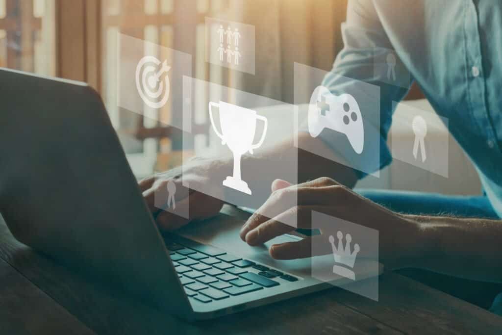 Laptop with gamification icons and online course