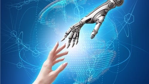 a robot and a hand reaching for each other