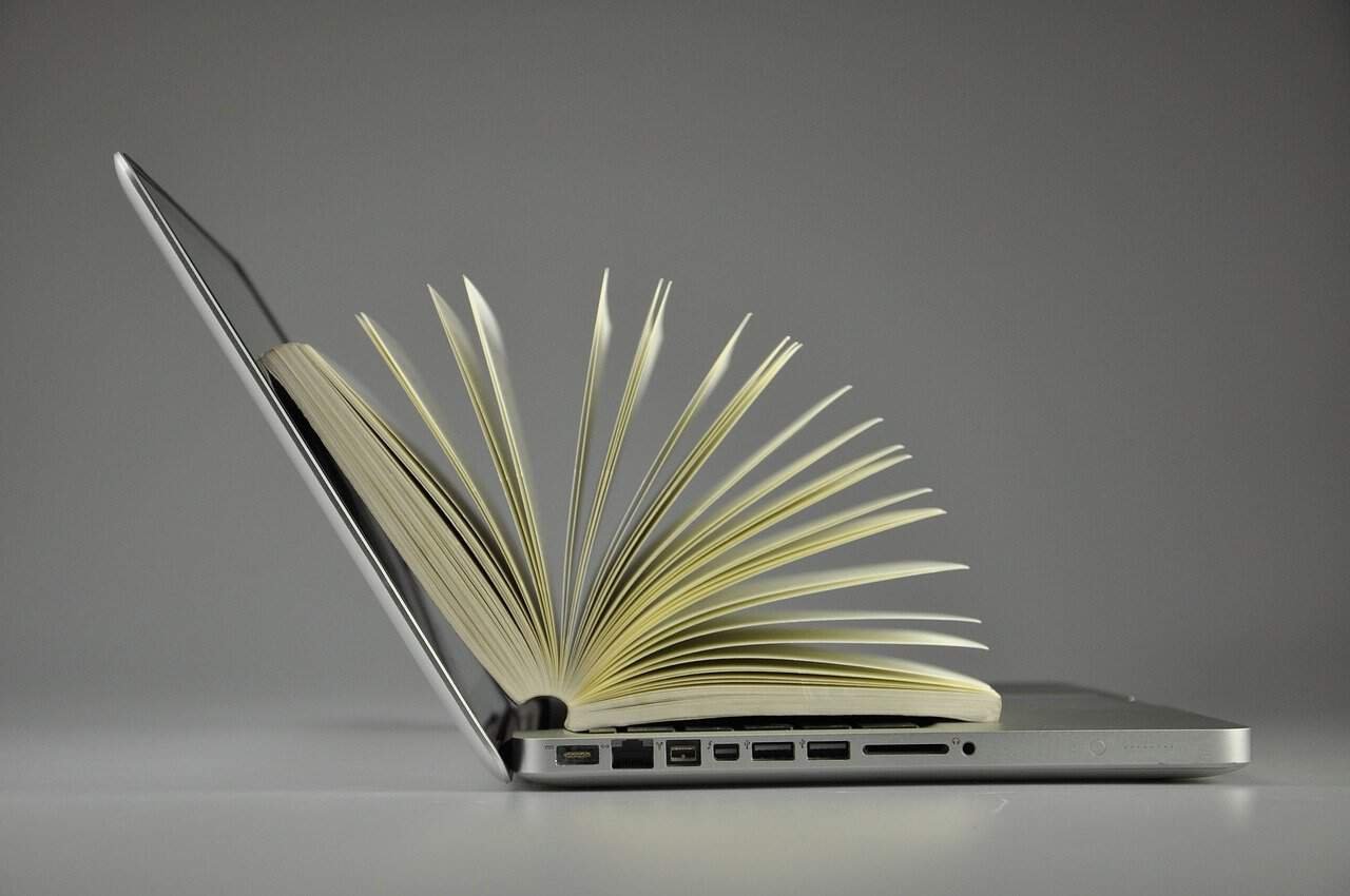 laptop with a book inside