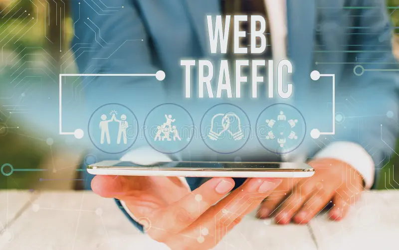 Man in suit holding a plate with the words "web traffic"