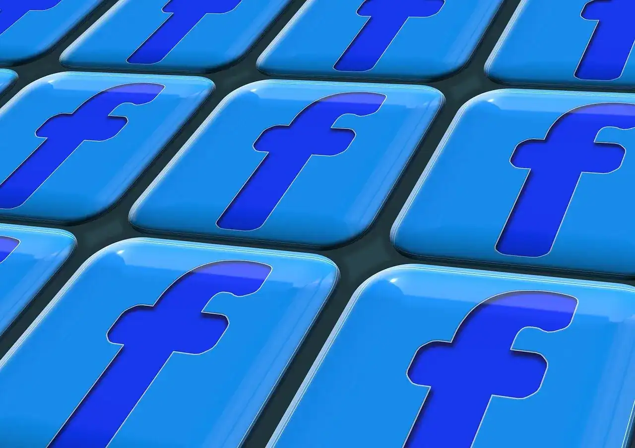 Close-up of multiple blue Facebook logo icons arranged in a grid, symbolizing social media and online networking.